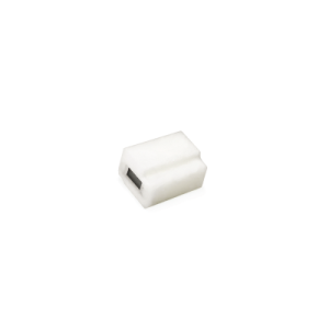 A small, white, rectangular plastic object from the B12450 Series with a black rectangular slot or opening on one side, set against a plain white background—ideal for applications as a Magnetic Float Switch. by Standex Detect