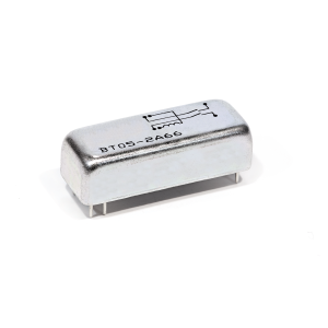 A silver, rectangular electronic component from the BT Series with four pins and a circuit symbol printed on top, labeled BT05-2466 Reed Relay, placed on a white background. by Standex Detect