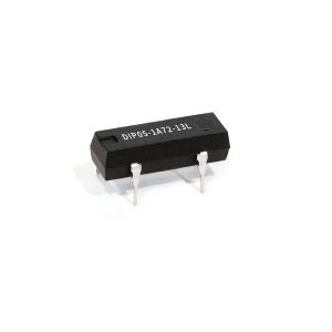 A small black integrated circuit Reed Relay with four metal pins, labeled DIP05-1A72-13L from the DIP Series, set against a plain white background. by Standex Detect
