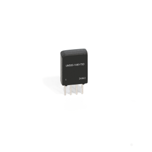 A small black Reed Relay electronic component from the UMS Series with four metal pins and the label UM505-1A80-75D 24082 printed on its front, standing upright on a white background. by Standex Detect