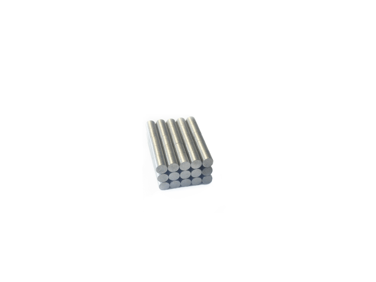 Nine short, cylindrical samarium cobalt magnets are stacked in a neat rectangular arrangement against a plain white background. by Standex Detect