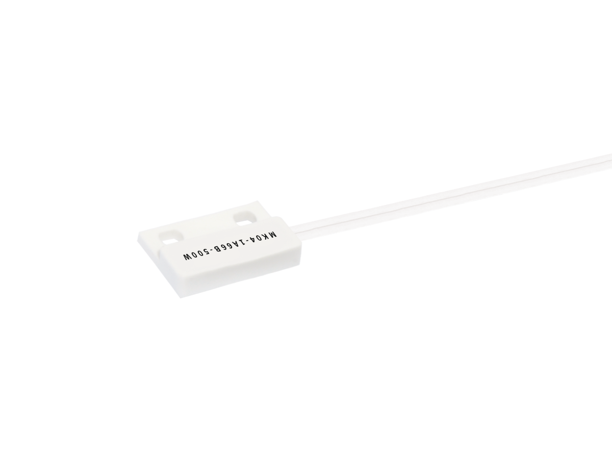 A small white rectangular MK04 Series Reed Sensor with two mounting holes and an attached white wire extending from one side. The sensor is labeled “M05-0501V1-10WH.” The background is plain white. by Standex Detect