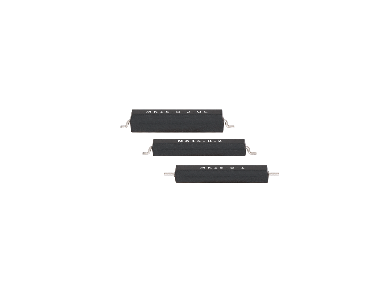 Three black rectangular MK15 Series Surface Mount Reed Switch components, labeled MK15-B-2.0E, MK15-B-2, and MK15-B-1, are arranged in a staggered line on a white background with silver terminals. by Standex Detect