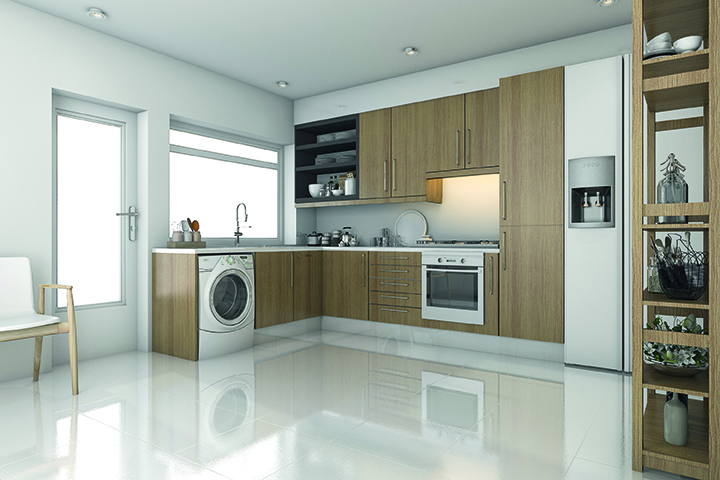 Modern kitchen with wooden cabinets, white countertops, built-in oven, and washing machine. Open shelves display dishes; a window and door provide natural light. ElectronicsWeekly readers may spot smart features using Hall-Effect Switches or reed switches. by Standex Detect