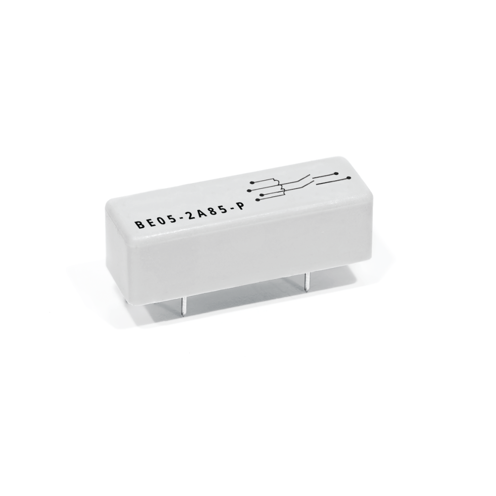 A white rectangular Reed Relay from the BE Series, featuring four metal pins on the bottom, circuit diagram markings, and the label BE05-2485-P printed on top. by Standex Detect