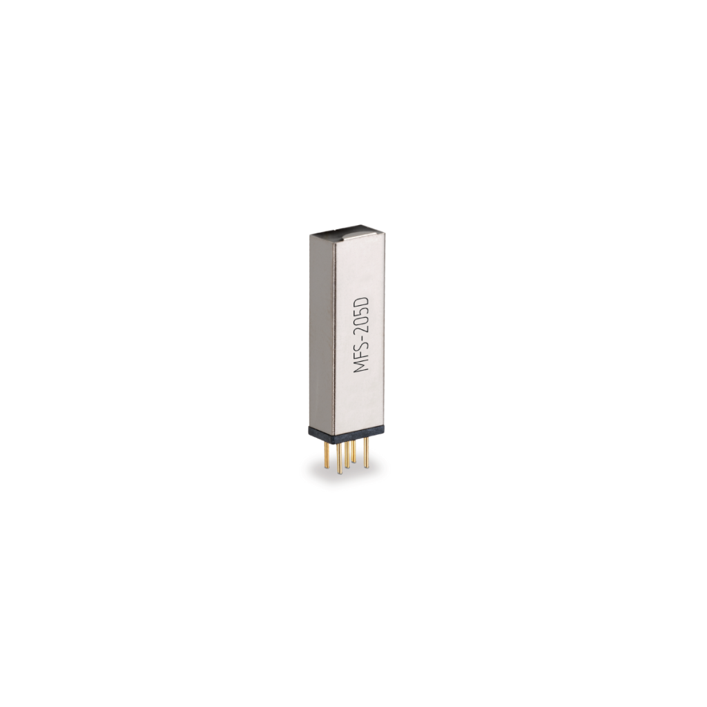 A rectangular metallic electronic component labeled NFS-205D from the MFS Series, featuring four gold pins at the bottom, stands upright against a white background. by Standex Detect