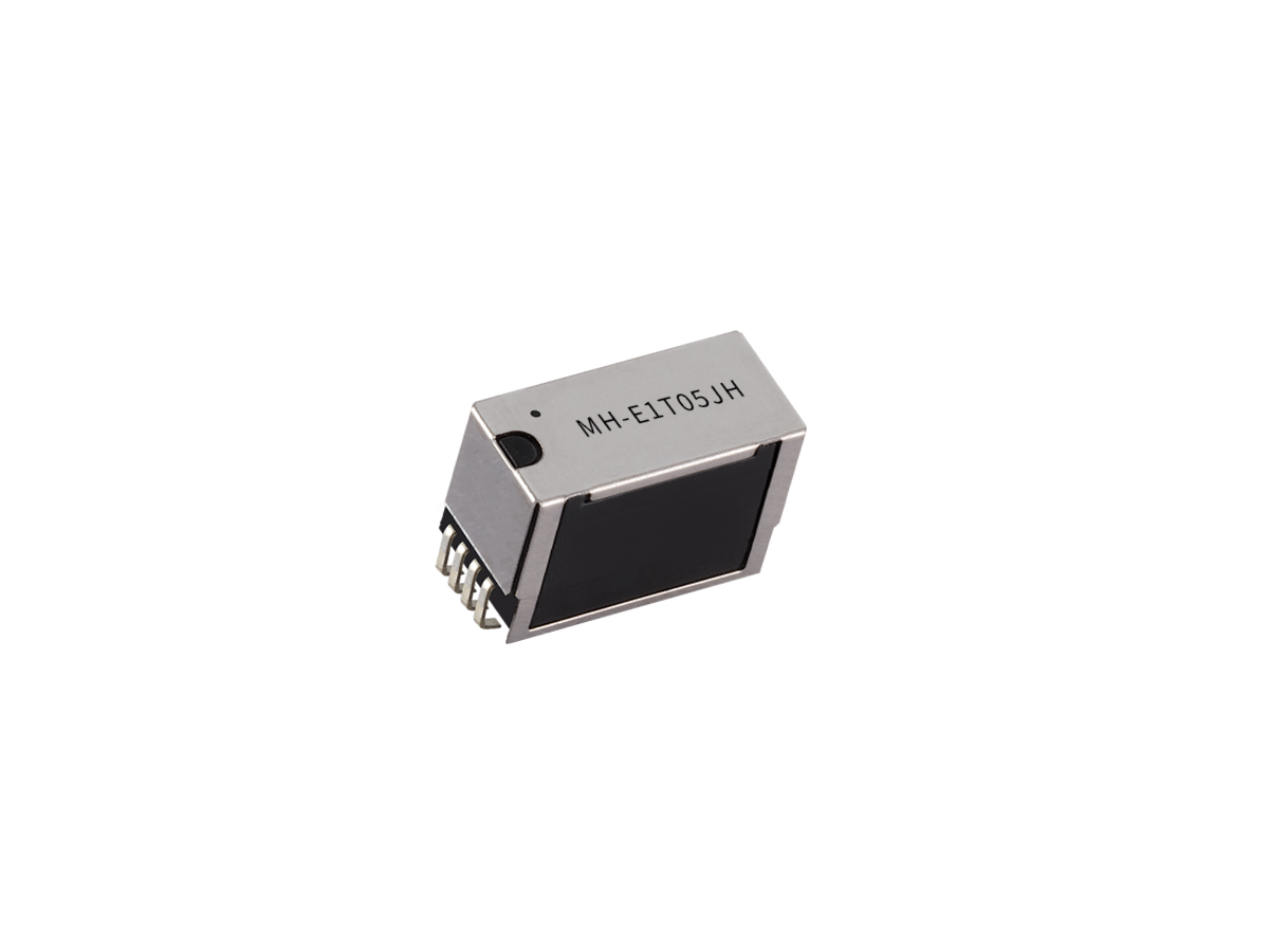 A small rectangular electronic component from the MH Series featuring a metal casing, black base, and four visible pins on one side. The top is labeled MH-E1T05JH, indicating it is a Reed Relay. The background is plain white. by Standex Detect