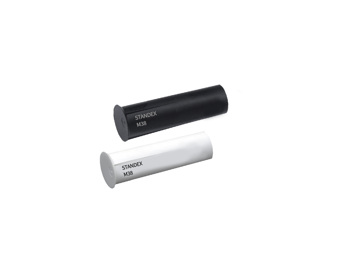 Two cylindrical electronic components, one black and one white, both labeled STANDEX M38, possibly part of the M36 series magnet line, shown on a white background. by Standex Detect